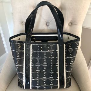 (1477) Kate Spade black & white coated canvas tote with patten leather trim.
